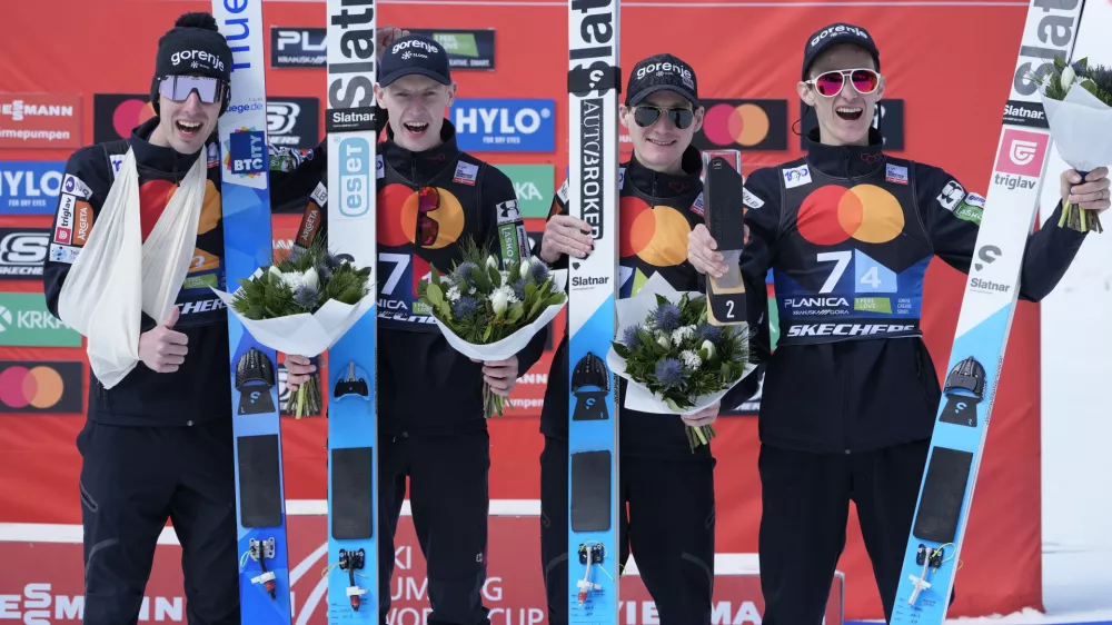 Slovenian team celebrate their second place at the Ski Jumping World Cup team competition in Planica, Slovenia, Saturday, March 23, 2024. (AP Photo/Darko Bandic)