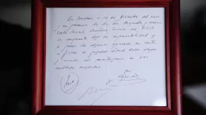 FILE - A framed copy of the napkin linking the 13-year-old Lionel Messi to FC Barcelona is seen in Barcelona, Spain on Jan. 5, 2012. British auction house Bonhams says the famous napkin that linked a young Lionel Messi to Barcelona has sold for 5,000. An agreement in principle to sign then 13-year-old Messi was written on the napkin almost 25 years ago at a Barcelona tennis club. (AP Photo/Manu Fernandez, File)