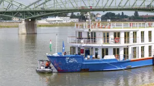 Police investigators examine the bow of a river cruise ship after an incident, in Komarom, Hungary, Sunday, May 19, 2024. Police say two people have died and five are missing following a boat collision on the Danube River in Hungary. Hungarian police received a report late Saturday night that a man had been found with a head injury on the shore of the Danube near the town of Veroce, around 30 miles (50 kilometers) north of the capital, Budapest. (Peter Lakatos/MTI via AP)