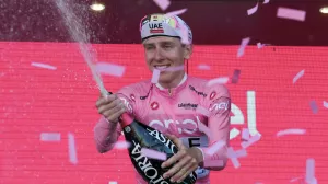 18 May 2024, Italy, Desenzano del Garda: Slovenian cyclist Tadej Pogacar of Team UAE Emirates celebrates on the podium with Pink jersey after the stage 14 of the Giro d'Italia 2024, 31.2 km from Castiglione delle Stiviere to Desenzano del Garda. Photo: Gian Mattia D\'alberto/LaPresse via ZUMA Press/dpa