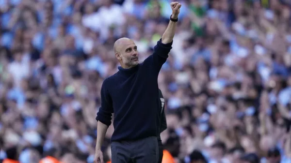 Manchester City's head coach Pep Guardiola celebrates at the end of the English Premier League soccer match between Manchester City and West Ham United at the Etihad Stadium in Manchester, England, Sunday, May 19, 2024. Manchester City clinched the English Premier League on Sunday after beating West Ham in their last match of the season. (AP Photo/Dave Thompson)