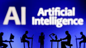 FILE PHOTO: Figurines with computers and smartphones are seen in front of the words "Artificial Intelligence AI" in this illustration taken, February 19, 2024. REUTERS/Dado Ruvic/Illustration/File Photo