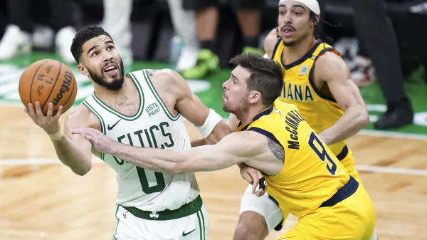 May 21, 2024; Boston, Massachusetts, USA; Indiana Pacers guard T.J. McConnell (9) defends against Boston Celtics forward Jayson Tatum (0) in over-time during game one of the eastern conference finals for the 2024 NBA playoffs at TD Garden. Mandatory Credit: David Butler II-USA TODAY Sports