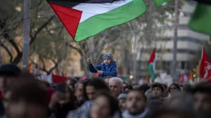 FILE - A boy waves a Palestinian flag as demonstrators march during a protest in support of Palestinians and calling for an immediate ceasefire in Gaza, in Barcelona, Spain, on Jan. 20, 2024. European Union countries Spain and Ireland as well as Norway on Wednesday announced dates for recognizing Palestine as a state. (AP Photo/Emilio Morenatti, File)