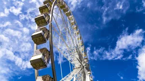 Ferris Wheel named Budapest Eye in Budapest, Hungary on a sunny cloudy day.