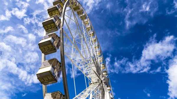 Ferris Wheel named Budapest Eye in Budapest, Hungary on a sunny cloudy day.