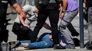 FILE PHOTO: A person is detained after shooting incident of Slovak PM Robert Fico, after a Slovak government meeting in Handlova, Slovakia, May 15, 2024. REUTERS/Radovan Stoklasa/File Photo