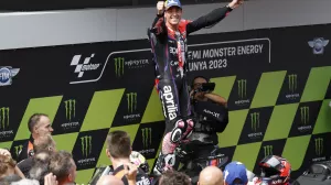 Sapin's Aleix Espargaro celebrates after winning the MotoGP race of the Catalunya Motorcycle Grand Prix at the Catalunya racetrack in Montmelo, just outside of Barcelona, Spain, Sunday, Sept. 3, 2023. (AP Photo/Joan Monfort)