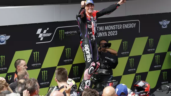 Sapin's Aleix Espargaro celebrates after winning the MotoGP race of the Catalunya Motorcycle Grand Prix at the Catalunya racetrack in Montmelo, just outside of Barcelona, Spain, Sunday, Sept. 3, 2023. (AP Photo/Joan Monfort)