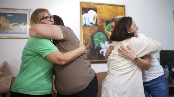 Members of the association Mothers of Srebrenica react after the United Nations General Assembly adopted a resolution declaring July 11 the International Day of Reflection and Commemoration of the 1995 genocide in Srebrenica, in Potocari, Bosnia, Thursday, May 23, 2024. (AP Photo/Armin Durgut)