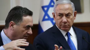 ﻿FILE - In this Sept. 5, 2018 file photo, Israeli Prime Minister Benjamin Netanyahu, right, listens to then Transportation and Intelligence Minister Israel Katz during the weekly cabinet meeting at the Prime Minister's office in Jerusalem. Netanyahu announced Sunday, Feb 17, 2019 that he has appointed Katz an interim foreign minister after holding the post himself for the last four years. (Ronen Zvulun/Pool Photo via AP, File)