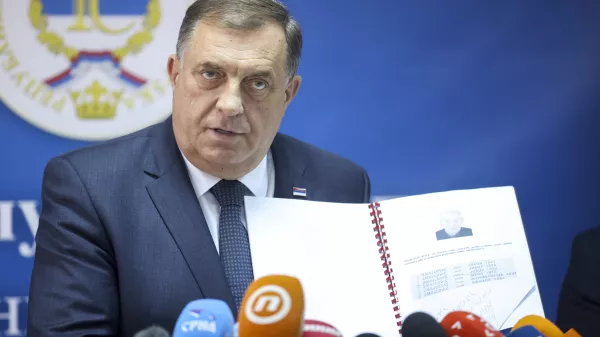 Bosnian Serb political leader Milorad Dodik speaks and shows documents during a press conference in Srebrenica, Bosnia, Thursday, May 23, 2024. Today the United Nations General Assembly will be voting on a draft resolution declaring July 11 the International Day of Reflection and Commemoration of the 1995 genocide in Srebrenica. (AP Photo/Armin Durgut)