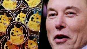 A photo of Elon Musk is displayed on a smartphone placed on representations of cryptocurrency Dogecoin in this illustration taken June 16, 2022. REUTERS/Dado Ruvic/Illustration