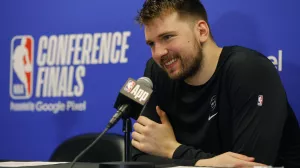 Dallas Mavericks guard Luka Doncic (77) smiles during a news conference after Game 2 of the NBA basketball Western Conference finals, Friday, May 24, 2024, in Minneapolis. (AP Photo/Bruce Kluckhohn)