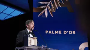 Sean Baker accepts the Palme d'Or for the film 'Anora,' during the awards ceremony of the 77th international film festival, Cannes, southern France, Saturday, May 25, 2024 (Photo by Andreea Alexandru/Invision/AP)