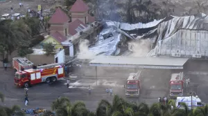 Firefighters douse a fire which broke out in a fun park, in Rajkot in the Indian state of Gujarat, Saturday, May 25, 2024. A massive fire broke out on Saturday in a fun park in western India, killing more than ten people and injuring some others, news reports said. (AP Photo/Chirag Chotaliya)