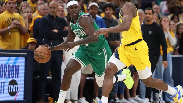 May 25, 2024; Indianapolis, Indiana, USA; Boston Celtics guard Jrue Holiday (4) brings the ball up court against Indiana Pacers forward Aaron Nesmith (23) during the fourth quarter of game three of the eastern conference finals in the 2024 NBA playoffs at Gainbridge Fieldhouse. Mandatory Credit: Trevor Ruszkowski-USA TODAY Sports