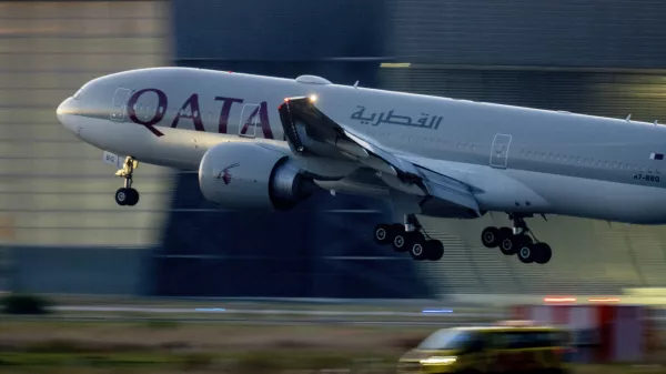 FILE - A Qatar airways plane lands at the airport in Frankfurt, Germany, as the sun rises on Sept. 25, 2023. Twelve people were injured when a Qatar Airways plane flying from Doha to Dublin on Sunday May 26, 2024 hit turbulence, airport authorities said. (AP Photo/Michael Probst, File)