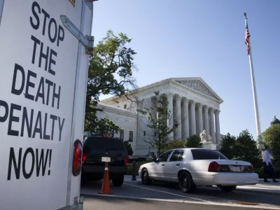 ﻿A vehicle parked near the Supreme Court in Washington, has signage that says "Stop The Death Penalty Now," Monday June 29, 2015. The Supreme Court is meeting for the final time until the fall to decide three remaining cases and add some new ones for the term that starts in October. The three remaining cases that are expected to be decided Monday raise important questions about a controversial drug that was implicated in botched executions, state efforts to reduce partisan influence in congressional redistricting and costly Environmental Protection Agency limits on the emission of mercury and other toxic pollutants from power plants. (AP Photo/Jacquelyn Martin)