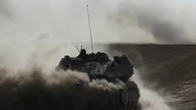 An Israeli tank operates, amid the ongoing conflict between Israel and the Palestinian Islamist group Hamas, near Israel's border with Gaza in southern Israel, May 29, 2024. REUTERS/Ronen Zvulun. REFILE - CORRECTING FROM "ARMOURED PERSONNEL CARRIER (APC)" TO "TANK".