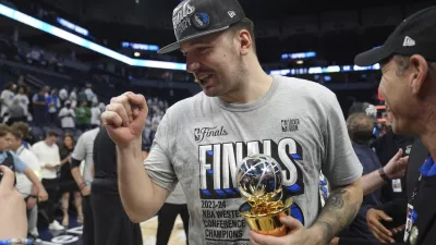 Dallas Mavericks guard Luka Doncic celebrates the team's win over the Minnesota Timberwolves' in Game 5 of the Western Conference finals in the NBA basketball playoffs Thursday, May 30, 2024, in Minneapolis. The Mavericks won 124-103, taking the series 4-1 and moving on to the NBA Finals. (AP Photo/Abbie Parr)