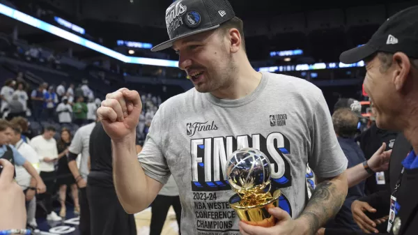 Dallas Mavericks guard Luka Doncic celebrates the team's win over the Minnesota Timberwolves' in Game 5 of the Western Conference finals in the NBA basketball playoffs Thursday, May 30, 2024, in Minneapolis. The Mavericks won 124-103, taking the series 4-1 and moving on to the NBA Finals. (AP Photo/Abbie Parr)