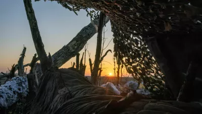 The sun rises over the battlefield near a frontline trench in the Donetsk region, amid Russia's attack on Ukraine, April 13, 2024. To match Special Report UKRAINE-WAR/FRONTLINE  REUTERS/Thomas Peter