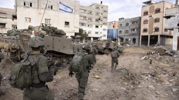 FILE - Israeli soldiers walk in Gaza City's Shijaiyah neighborhood on Dec. 8, 2023, as part of an operation to round up hundreds of Palestinians across the northern Gaza Strip and truck some to an undisclosed location. (AP Photo/Moti Milrod, Haaretz, File)