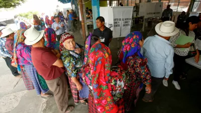 People wait in a line to vote at a polling station on the day of general elections, in San Bartolome Quialana, Mexico June 2, 2024. REUTERS/Jorge Luis Plata