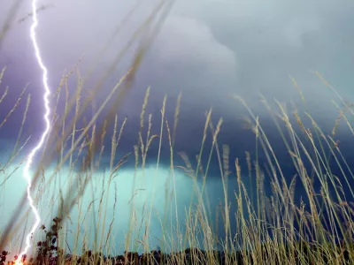 A lightning bolt hits the ground during a storm near O'Fallon, Ill., Monday, July 4, 2005. (AP Photo/The Post-Dispatch, Gabriel B. Tait)