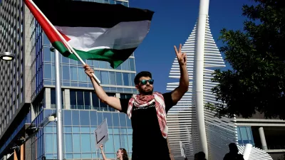 Abdullah Tahnat waves a Palestinian flag alongside other protesters as they call for a ceasefire in Gaza amid the ongoing conflict between Israel and the Palestinian Islamist group Hamas, in Oklahoma City, Oklahoma, U.S., May 31, 2024. REUTERS/Nick Oxford