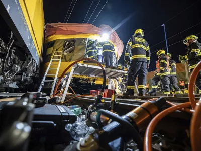 In this photo released by Fire Department of Pardubice region, rescue workers help injured passengers after two trains collided in Pardubice, Czech Republic Thursday, June 6, 2024. A passenger train collided head-on with a freight train in the Czech Republic, killing and injuring some people, officials said early Thursday. (Fire Department of Pardubice region via AP)