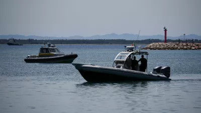 Guardia di Finanza boats are seen off shore, as Italy's Prime Minister Giorgia Meloni visits the construction sites of the migrant processing centre, off Shengjin, Albania June 5, 2024. REUTERS/Florion Goga