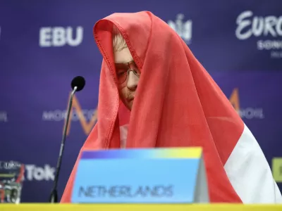 Joost Klein representing the Netherlands gestures, during a press conference after the second semi-final of the Eurovision Song Contest, at the Malmo Arena, in Malmo, Sweden, Thursday, May 9, 2024. Hours before the final, Dutch contestant Joost Klein was dramatically booted out by organizers over a backstage incident. He had failed to perform at two dress rehearsals on Friday, and contest organizer the European Broadcasting Union said it was investigating an "incident." (Jessica Gow /TT News Agency via AP)