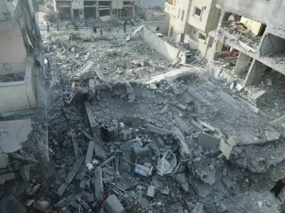 Palestinians inspect a house hit in an Israeli strike, due to an Israeli military operation, amid the Israel-Hamas conflict, in Nuseirat refugee camp in the central Gaza Strip, June 8, 2024. REUTERS/Ramadan Abed