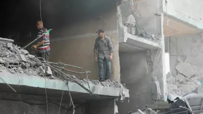 Palestinians inspect a house hit in an Israeli strike, due to an Israeli military operation, amid the Israel-Hamas conflict, in Nuseirat refugee camp in the central Gaza Strip, June 8, 2024. REUTERS/Ramadan Abed