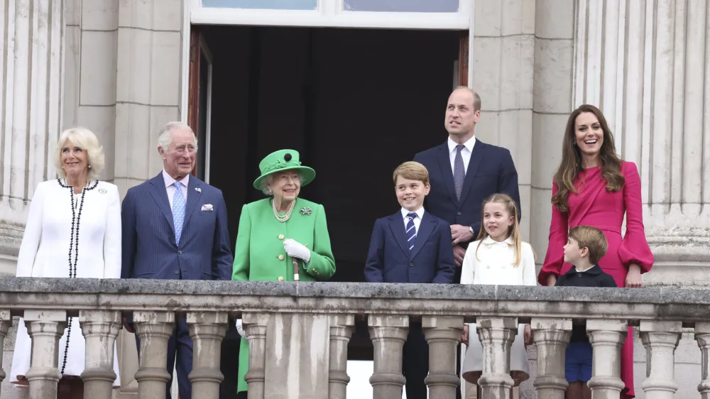 From left, Camilla Duchess of Cornwall, Prince Charles, Queen Elizabeth II, Prince George, Prince William, Princess Charlotte, Prince Louis, and Kate Duchess of Cambridge appear on the balcony of Buckingham Palace during the Platinum Jubilee Pageant outside Buckingham Palace in London, Sunday June 5, 2022, on the last of four days of celebrations to mark the Platinum Jubilee. The pageant will be a carnival procession up The Mall featuring giant puppets and celebrities that will depict key moments from the Queen Elizabeth II's seven decades on the throne. (Ian Vogler/Pool Photo via AP)