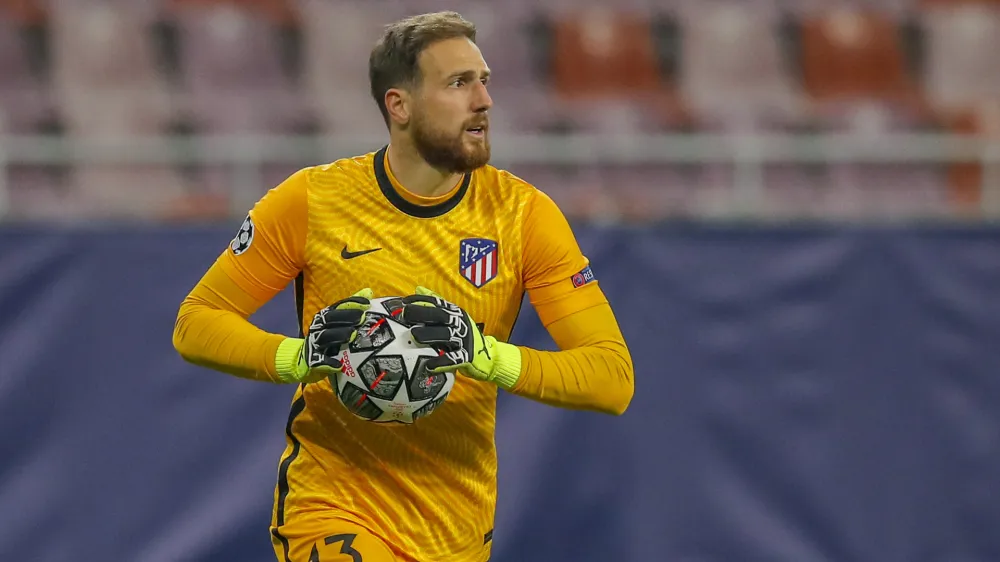 Atletico Madrid's goalkeeper Jan Oblak holds the ball during the Champions League, round of 16, first leg soccer match between Atletico Madrid and Chelsea at the National Arena stadium in Bucharest, Romania, Tuesday, Feb. 23, 2021. (AP Photo/Vadim Ghirda)