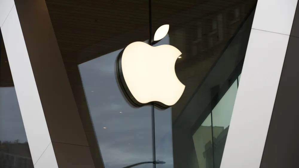 FILE - The Apple logo adorns the facade of a retail store. More than 100 employees of an Apple store in a suburb of Baltimore voted to unionize by a nearly 2-to-1 margin Saturday, June 18, 2022, joining a growing U.S. push across tech, retail and service industries to organize for greater workplace protections, a union said. (AP Photo/Kathy Willens, File)