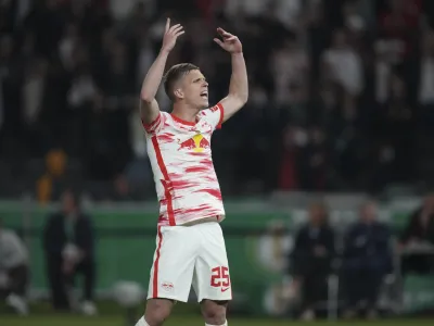 Leipzig's Daniel Olmo celebrates after scoring during a penalty kick out during the German Soccer Cup final match between SC Freiburg and RB Leipzig at the Olympic Stadium in Berlin, Germany, Saturday, May 21, 2022. (AP Photo/Michael Sohn)