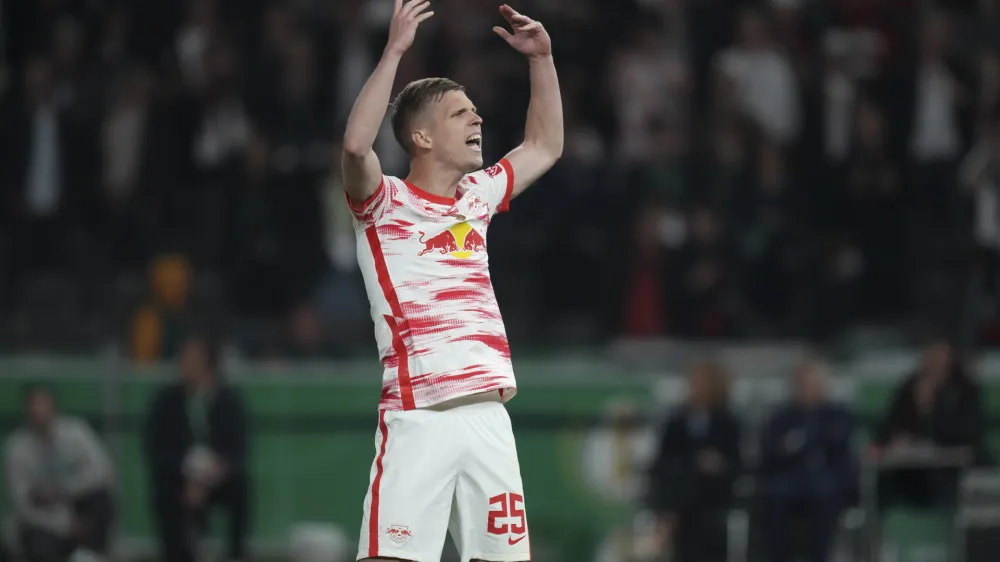 Leipzig's Daniel Olmo celebrates after scoring during a penalty kick out during the German Soccer Cup final match between SC Freiburg and RB Leipzig at the Olympic Stadium in Berlin, Germany, Saturday, May 21, 2022. (AP Photo/Michael Sohn)