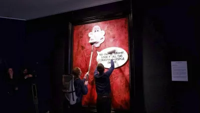 This photo released by Animal Rising shows activists pasting a picture of a character called Wallace, from the "Wallace and Gromit" comedy series, over a portrait of Britain's King Charles III at the Philip Mould Gallery in London, Tuesday June 11, 2024. Animal rights activists pasted a cartoon image over a portrait of King Charles III on Tuesday at a London art gallery, the latest in a series of incidents at U.K. museums as campaigners use vandalism to publicize their causes. (Animal Rising via AP)