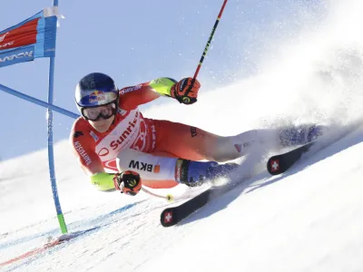 Switzerland's Marco Odermatt speeds down the course during an alpine ski, men's World Cup giant slalom race, in Adelboden, Switzerland, Saturday, Jan. 7, 2023. (AP Photo/Giovanni Pizzato)