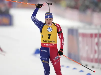 Julia Simon of France celebrates winning the women's 12.5km mass start competition at the Biathlon World Cup in Ruhpolding, Germany, Sunday, Jan. 15, 2023. (AP Photo/Matthias Schrader)