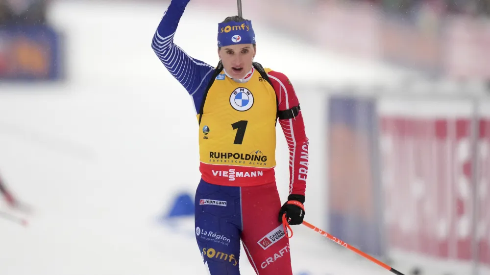 Julia Simon of France celebrates winning the women's 12.5km mass start competition at the Biathlon World Cup in Ruhpolding, Germany, Sunday, Jan. 15, 2023. (AP Photo/Matthias Schrader)