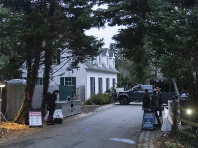 CORRECTS THAT THE FBI TOOK ITEMS THAT CONTAINED DOCUMENTS WITH CLASSIFIED MARKINGS INSTEAD OF SIX DOCUMENTS - FILE - The access road to President Joe Biden's home in Wilmington, Del., is seen from a media van on Jan. 13, 2023. The FBI searched Biden's home in Wilmington, Del., on Friday, Jan. 20, and located additional items consisting of documents with classified markings and also took possession of some of his handwritten notes, the president's lawyer said Saturday, Jan. 21. (AP Photo/Carolyn Kaster, File)