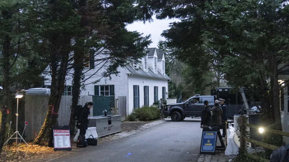 CORRECTS THAT THE FBI TOOK ITEMS THAT CONTAINED DOCUMENTS WITH CLASSIFIED MARKINGS INSTEAD OF SIX DOCUMENTS - FILE - The access road to President Joe Biden's home in Wilmington, Del., is seen from a media van on Jan. 13, 2023. The FBI searched Biden's home in Wilmington, Del., on Friday, Jan. 20, and located additional items consisting of documents with classified markings and also took possession of some of his handwritten notes, the president's lawyer said Saturday, Jan. 21. (AP Photo/Carolyn Kaster, File)