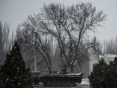 A Ukrainian serviceman sits atop of an infantry fighting vehicle on a road near a frontline, amid Russia's attack on Ukraine, in Donetsk region, Ukraine January 29, 2023. REUTERS/Viacheslav Ratynskyi