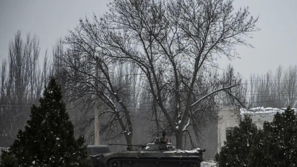 A Ukrainian serviceman sits atop of an infantry fighting vehicle on a road near a frontline, amid Russia's attack on Ukraine, in Donetsk region, Ukraine January 29, 2023. REUTERS/Viacheslav Ratynskyi