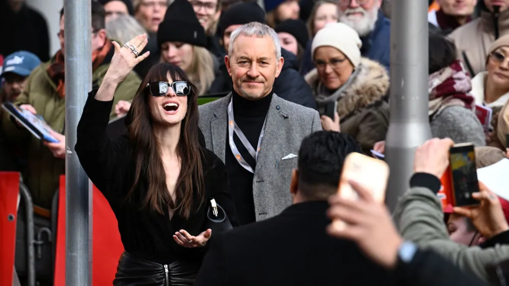 Cast member Anne Hathaway reacts as she arrives for a photocall and a news conference to promote the movie 'She Came to Me' at the 73rd Berlinale International Film Festival in Berlin, Germany, February 16, 2023. REUTERS/Annegret Hilse